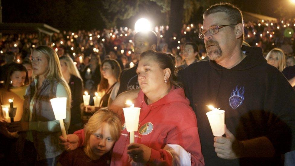 People at a vigil after Roseburg shooting, 1 Oct 2015