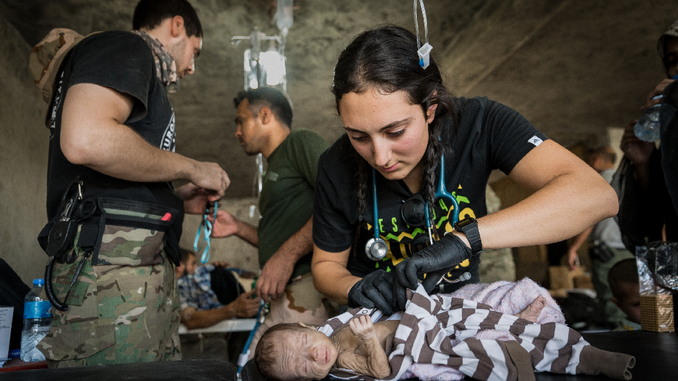 Katie Batrouney treating Suleyman, two months, in Mosul, Iraq