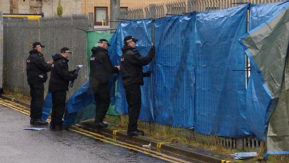 Police at barrier created at court