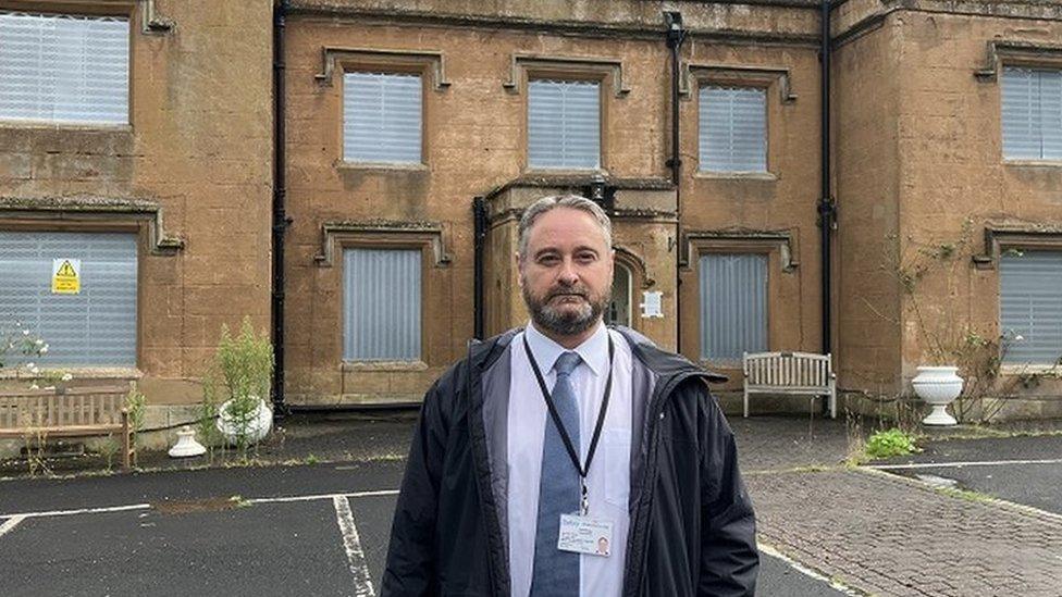 Councillor Paul Bradley outside the house