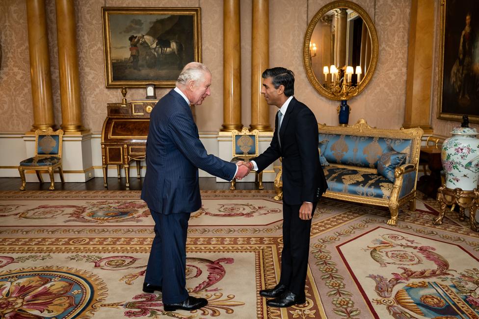 King Charles III welcomes Rishi Sunak during an audience at Buckingham Palace, London, where he invited the newly elected leader of the Conservative Party to become Prime Minister and form a new government on 25 October 2022