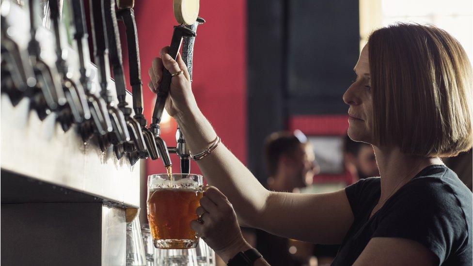 Woman working in a bar