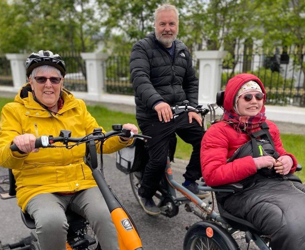 Sue Frecklington, Siggi Johannesson and his daughter Sunna riding bikes