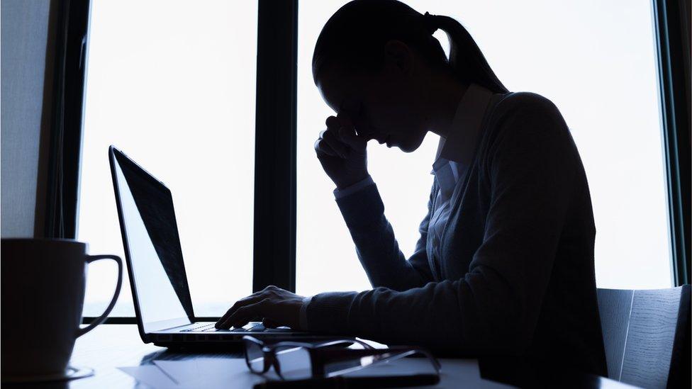 Stressed worker at desk