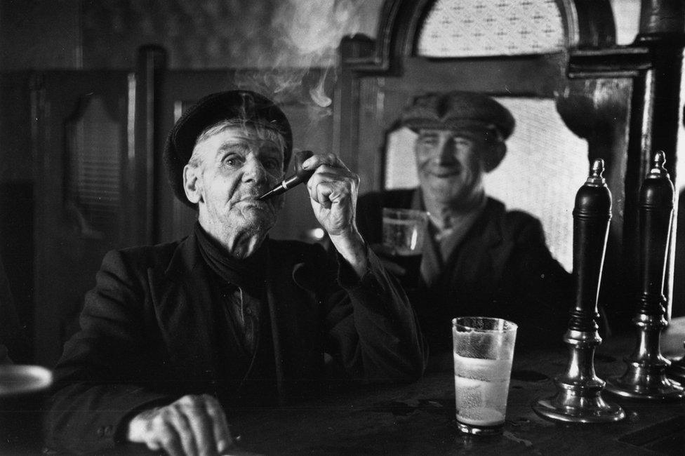 Two men in a 1950s Irish pub