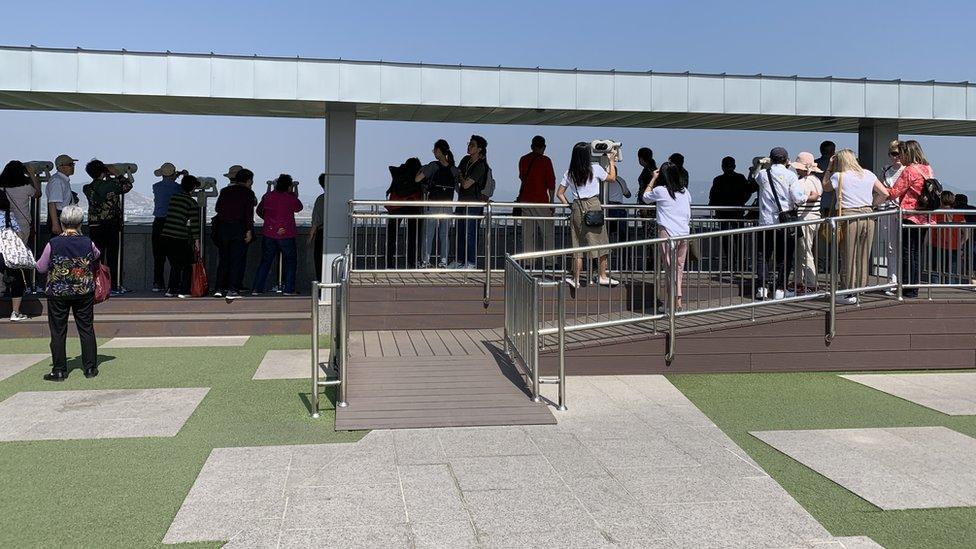 Tourists looking out towards North Korea