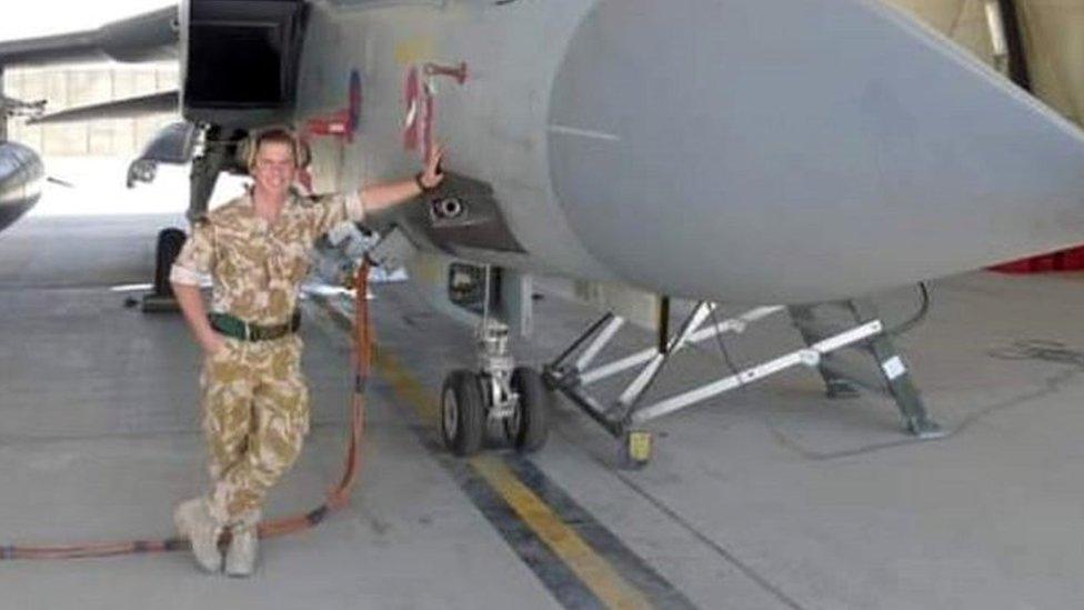 Sean in the Royal Marines next to aircraft