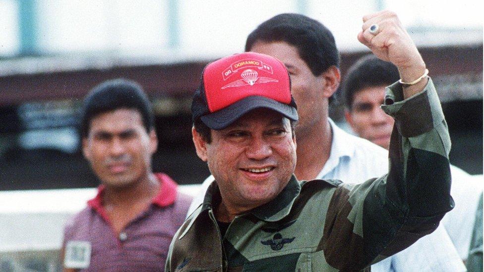 This 04 October, 1989, file photo shows former Panamanian strongman General Manuel Noriega waving as he left his headquarters in Panama City following a failed coup against him.