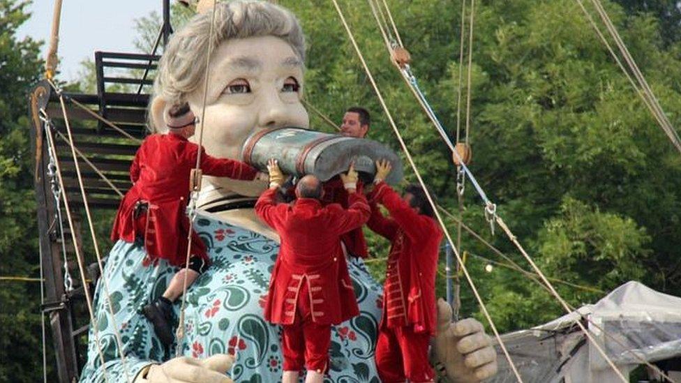 Grandmother Giant drinks from a hipflask