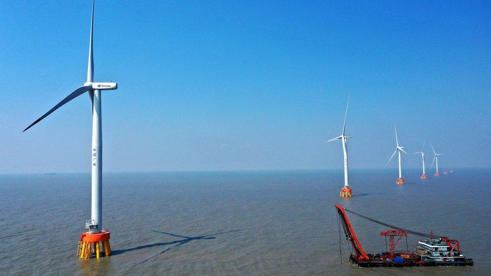 Wind turbines in the ocean.