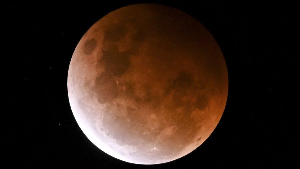 The Moon is seen over Sydney, Australia. Photo: 26 May 2021