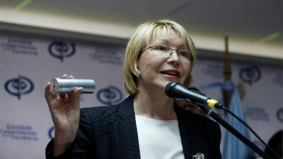 Venezuela's chief prosecutor Luisa Ortega Diaz displays a tear gas canister as she talks to the media during a news conference in Caracas, Venezuela May 24, 2017.