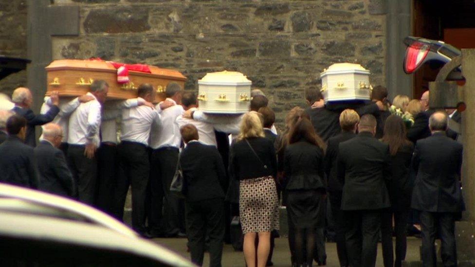 The coffins of the Hawe family are brought into the church