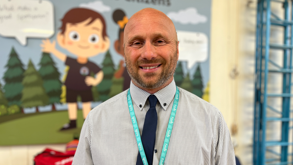 Four Acres Academy Bristol headteacher Matthew Cave smiles at the camera