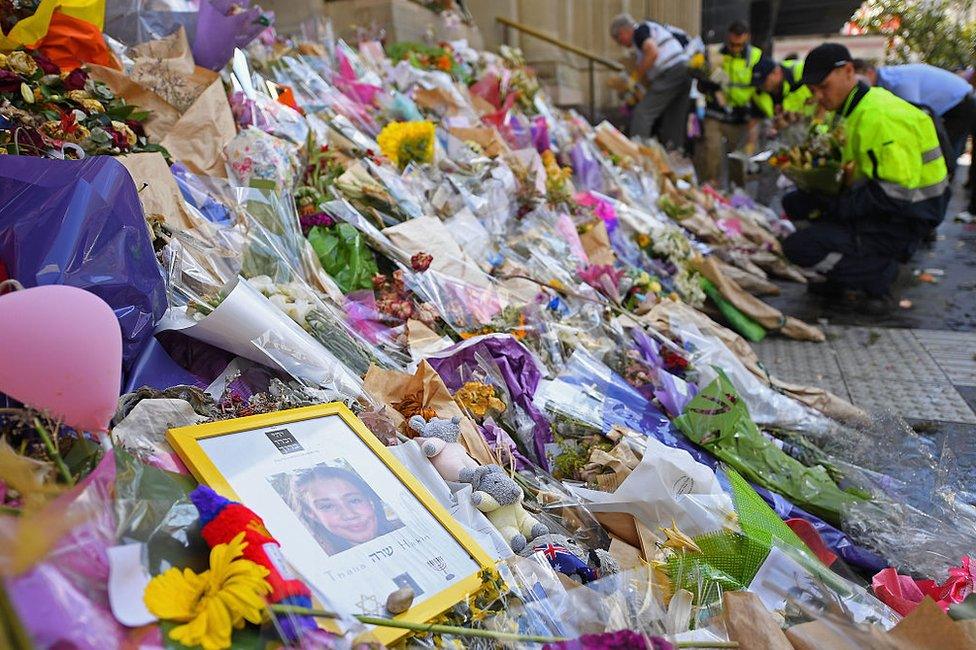 Teddy bears, candles, cards and flowers are removed from Bourke St in Melbourne