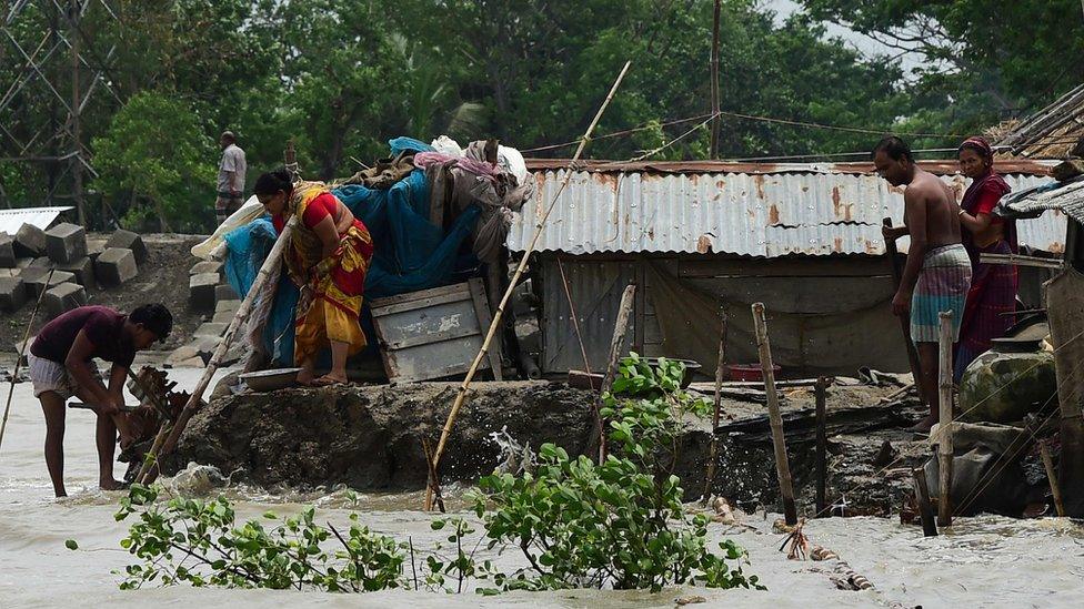 People try and fix their damaged homes in Khulna, Bangladesh after Cyclone Fani hit on May 4