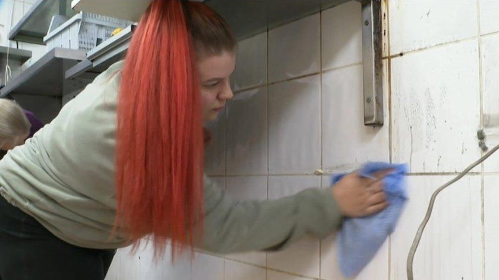 Jill Benson cleaning at her cafe