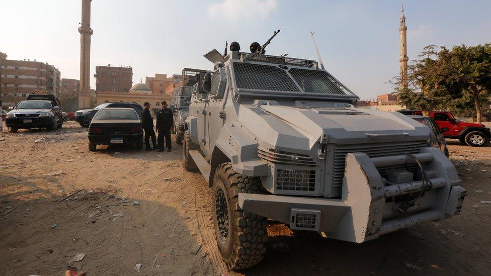 Security forces stand guard at the site of attack on a church in the Helwan district south of Cairo, Egypt on 29 December 2017