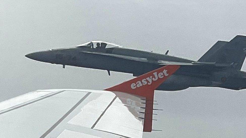 One of the two Spanish F18 fighters seen through the window of the easyJet flight from London to Menorca