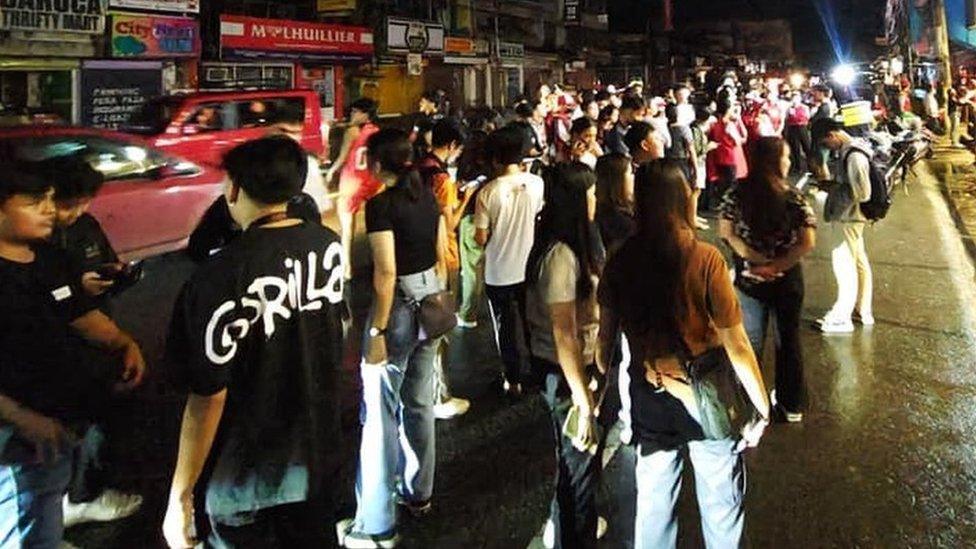 People gather on the streets of Butuan City after a powerful earthquake in Mindanao, Philippines. Photo: 2 December 2023