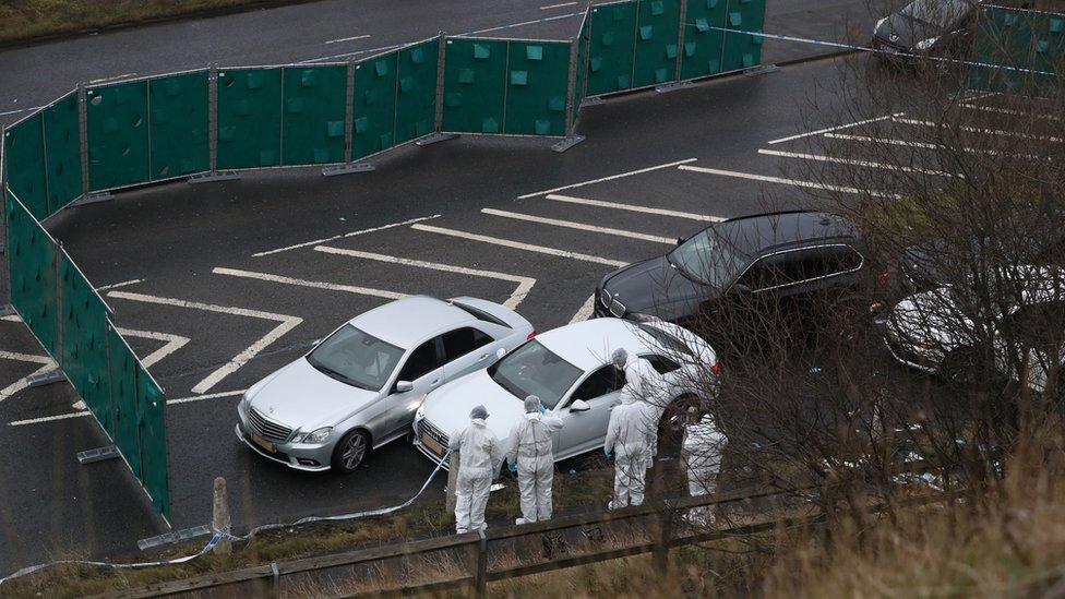 Forensic officers at scene of police shooting on M62