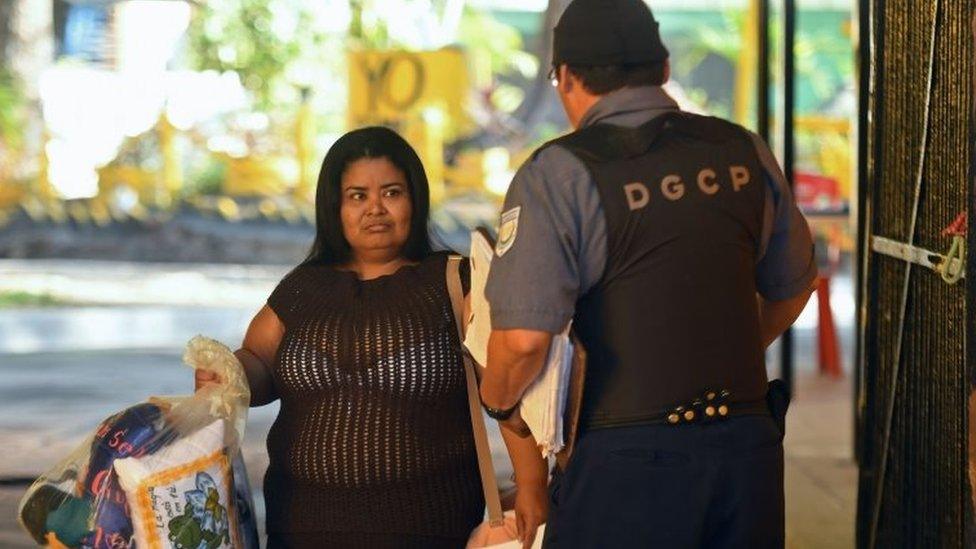 Maira Figueroa leaves the Women's Rehabilitation centre in Ilopango, El Salvador on March 13, 2018, where she was serving a sentence since 2003