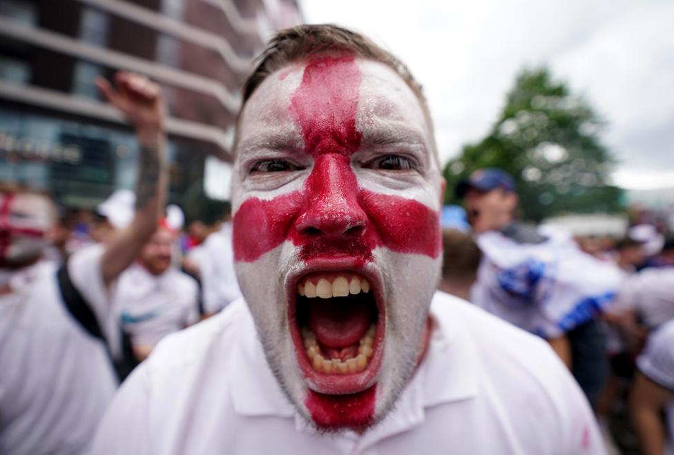 An England fan with a painted face outside Wembley Stadium, London, on 11 July 2021