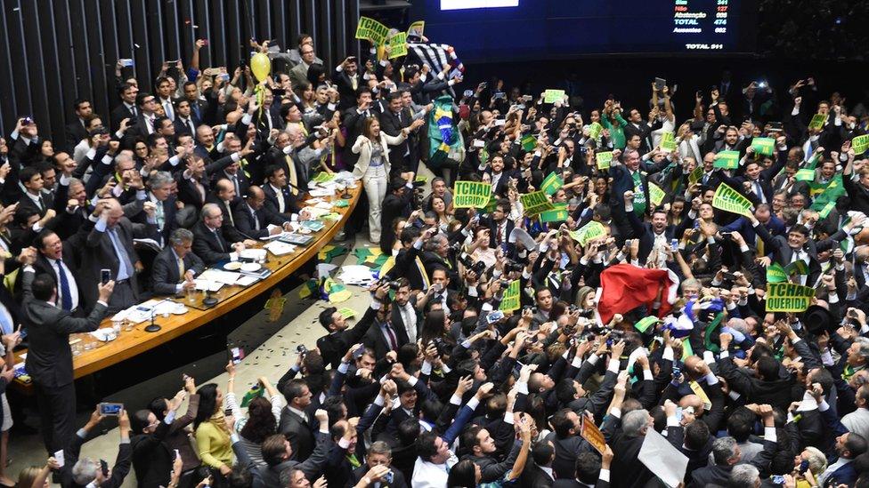 Brazil;s lawmakers celebrate after they reached the votes needed to authorize President Dilma Rousseff's impeachment to go ahead, at the Congress in Brasilia on 17 April