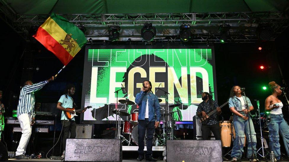 Johan Marley waving a flag at the event