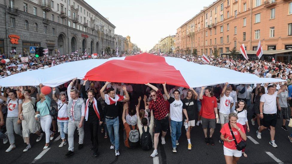 Belarusians attend a rally in support of the Belarusian opposition