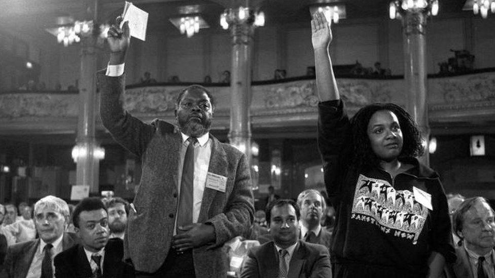 Black and white photograph of Diane Abbott raising her hand