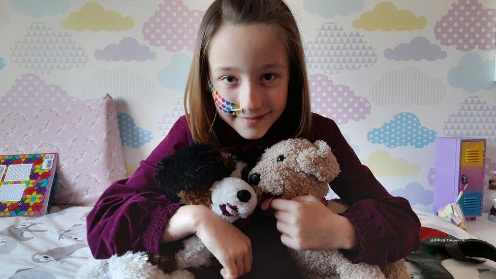 Imogen with stuffed animals