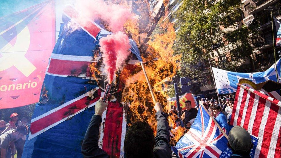 Protesters in the Argentinian capital Buenos Aires burning a British flag on the anniversary of the war's beginning