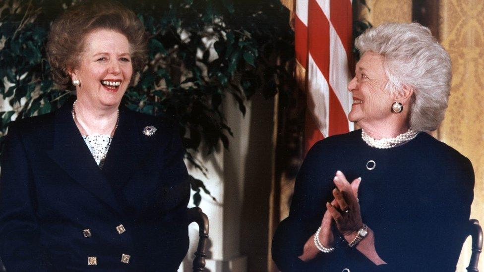 First Lady Barbara Bush (R) applauds after former British Prime Minister Margaret Thatcher (L) received the Presidential Medal of Freedom from US President George Bush in a White House ceremony 07 March 1991