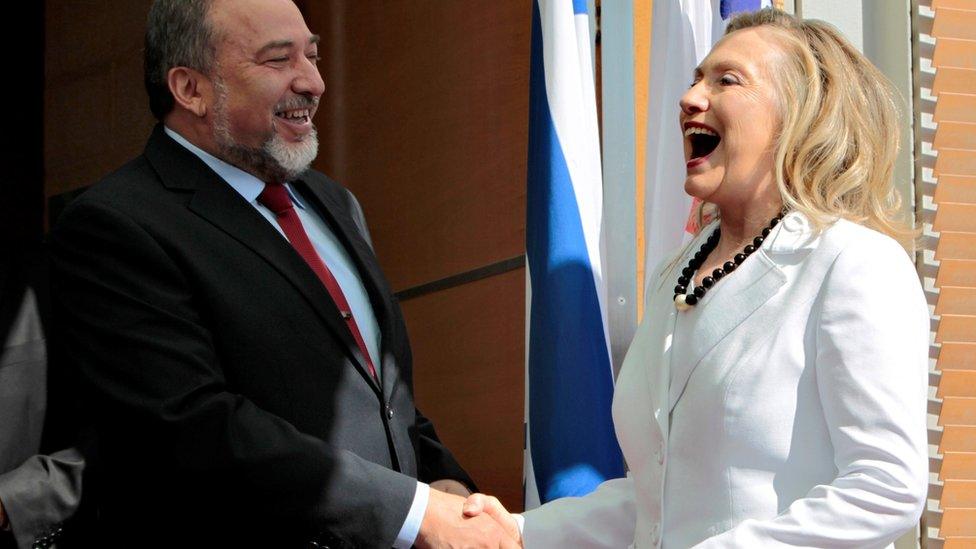 Avigdor Lieberman shakes hands with Hillary Clinton in Jerusalem (16 July 2012)