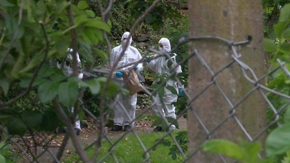 Forensic officers on site in the Quaker memorial garden