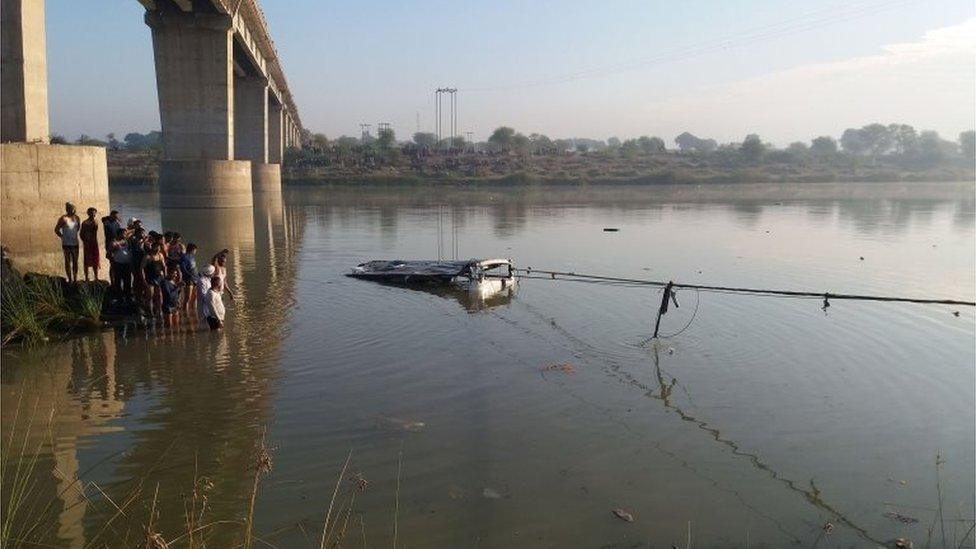 The scene of a bus accident in India's Rajasthan state, in which at least 32 people were killed, 23 December 2017