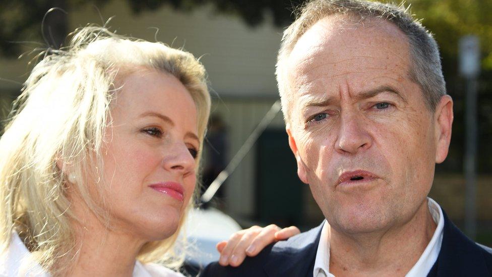 Chloe Shorten (l) looks at Bill Shorten as he speaks to media