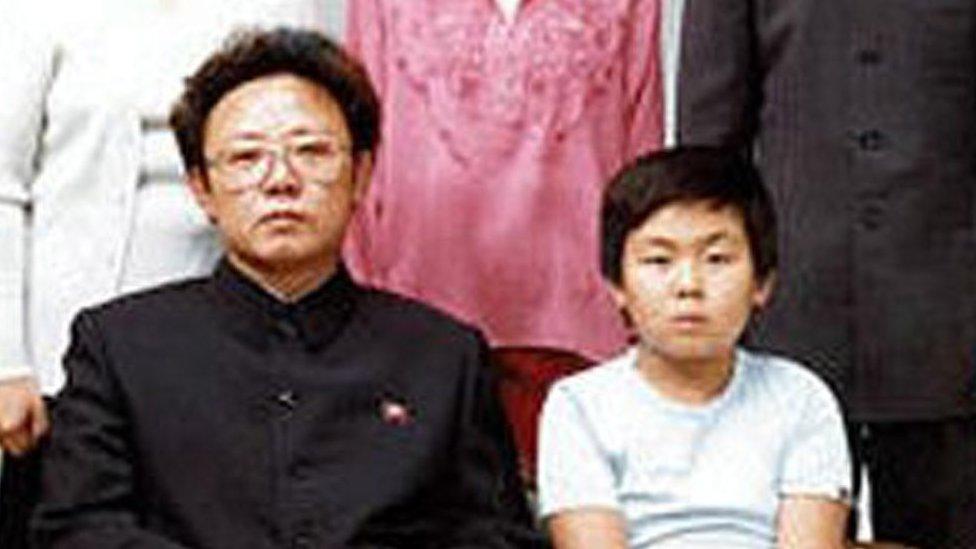 North Korean leader Kim Jong Il, bottom left, poses with his first-born son Kim Jong Nam, bottom right,