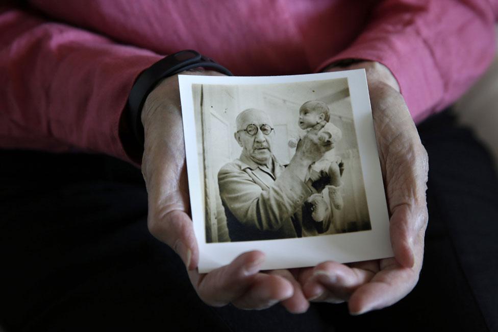 Beth Allen and a picture of Martin Couney holding her as a baby