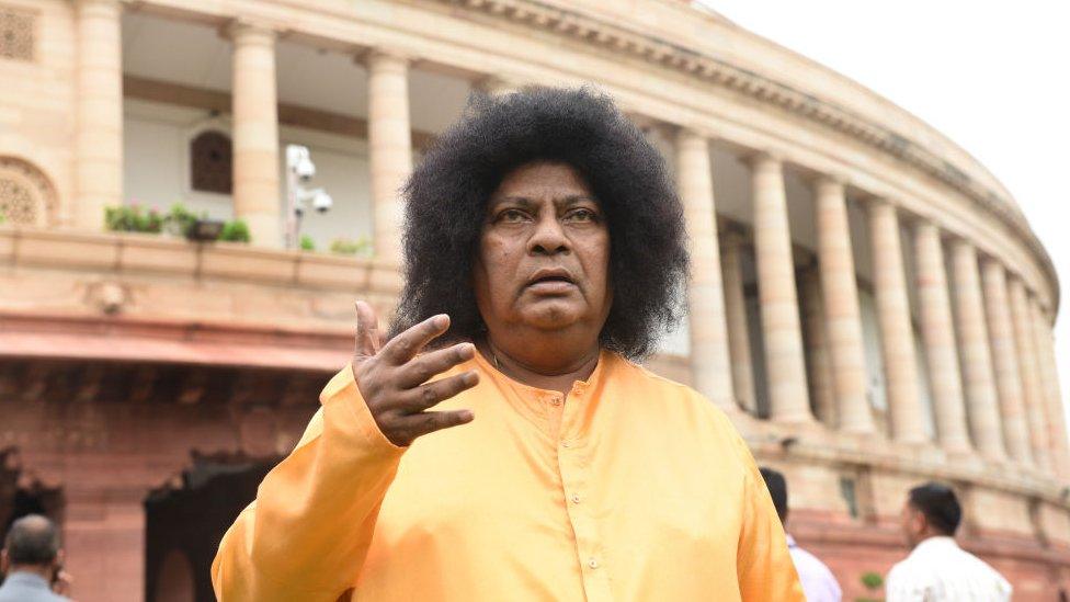 Mr Sivaprasad attends parliament dressed as Satya Sai Baba, a popular spiritual guru on 31 July 2018 in Delhi.