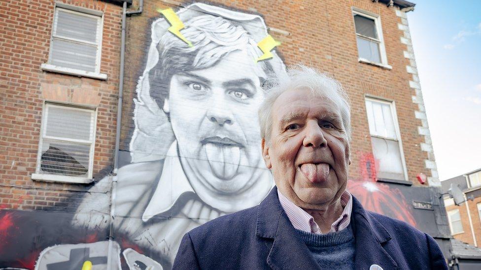 Terri Holey at belfast mural in his honour