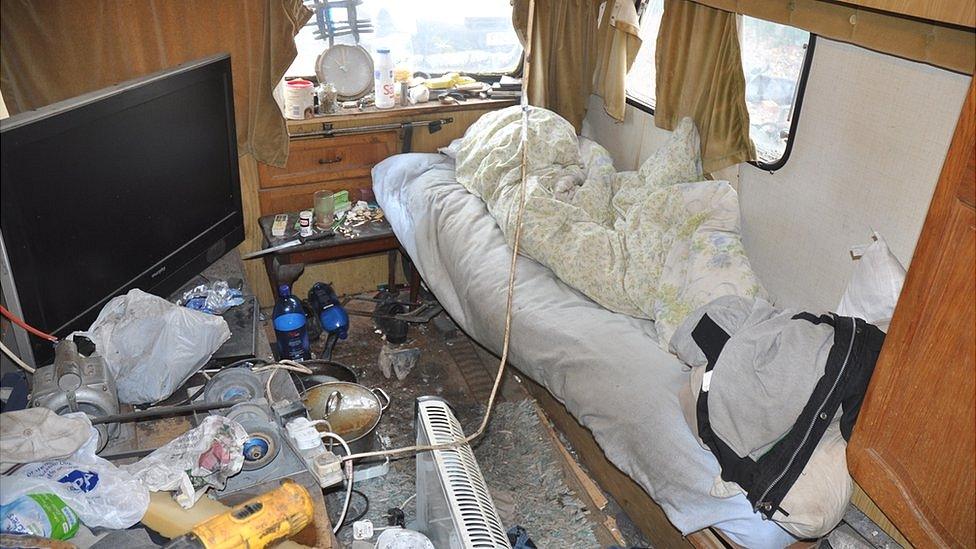 Mess and filth inside a caravan