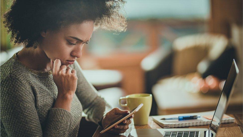 Stock shot of woman at computer