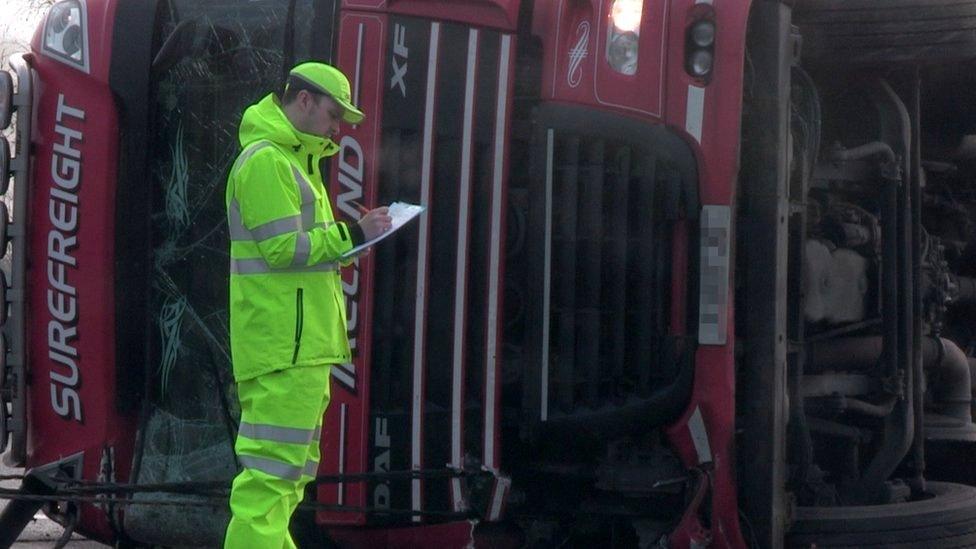 A lorry on its side on the A1