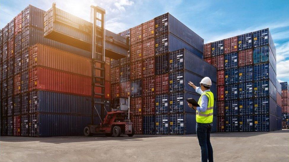 Man standing at container port