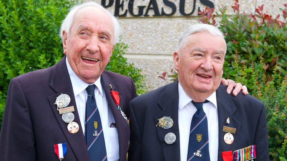 Two veterans outside the Pegasus Bridge museum