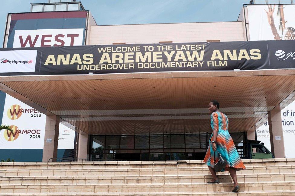 A woman walks up the stairs at the Accra International Conference Centre, where a documentary by undercover journalist Anas Aremeyaw Anas, is showing in Accra, Ghana June 7