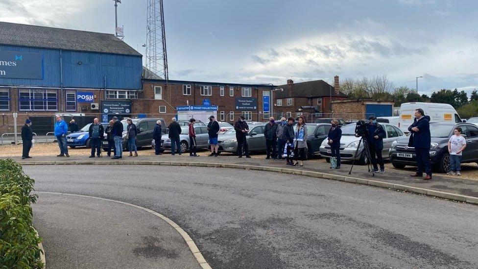 Fans gather at London Road stadium