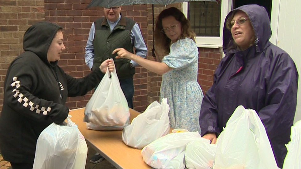 People queuing at a mobile food club in Wythenshawe